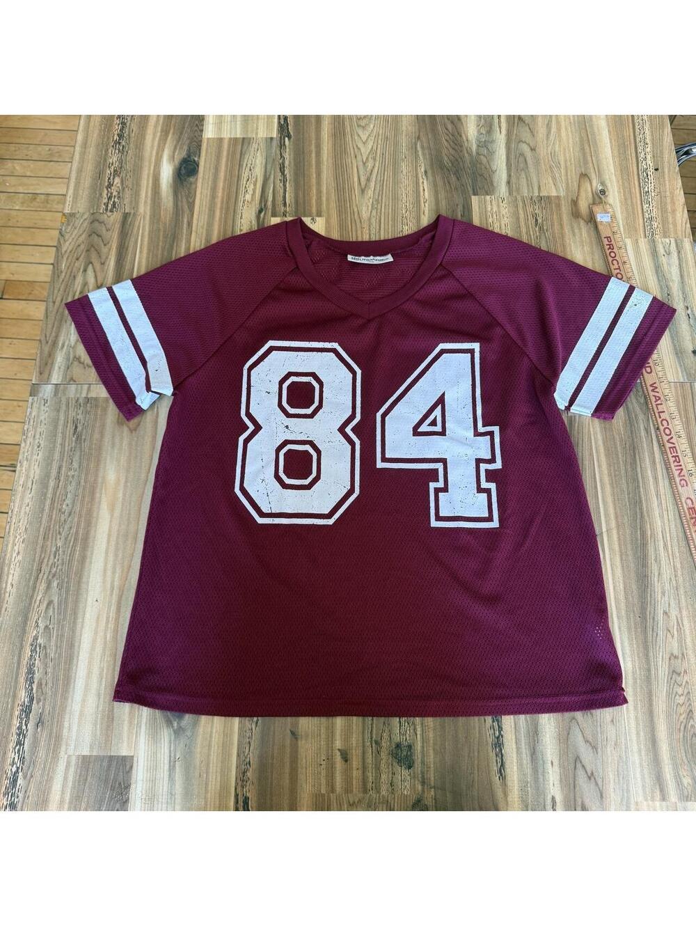 No Boundaries burgundy jersey with white number 84,
